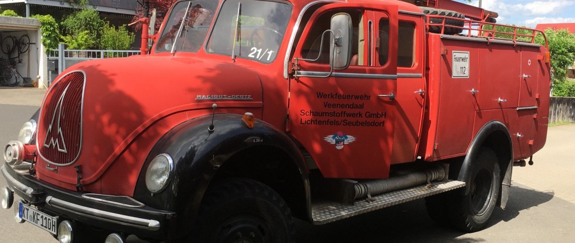 An old fire engine is ready to go out on the road