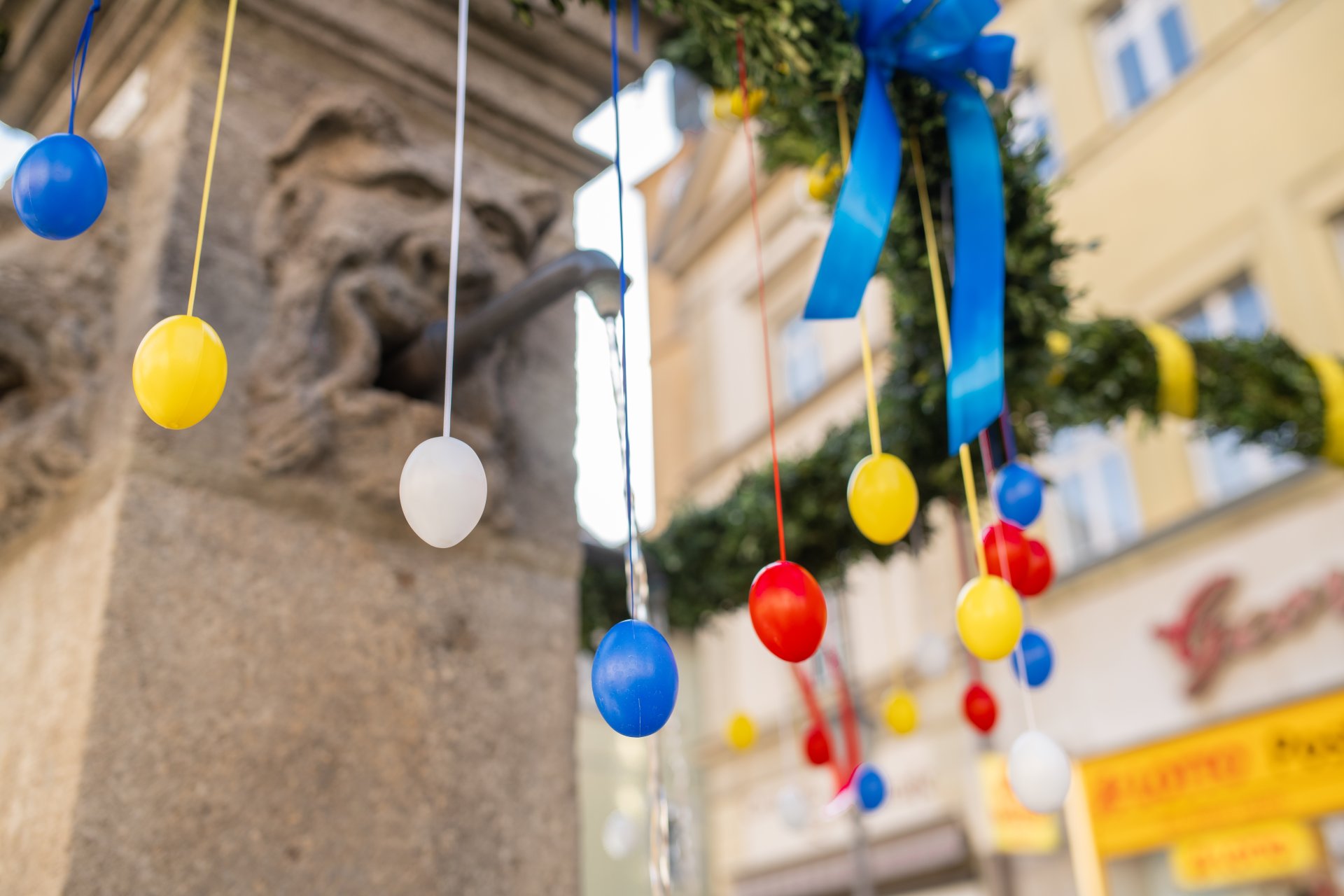 close-up of Easter decoration eggs on the fountain on the market square