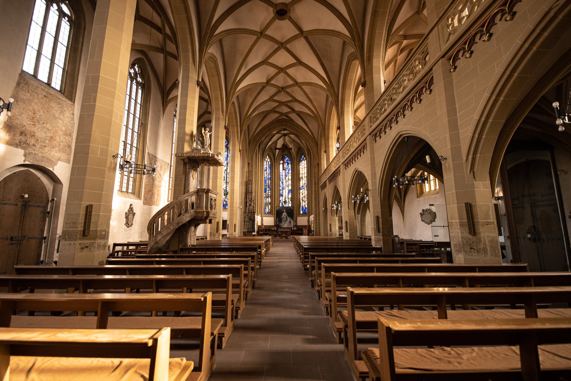 St John's Catholic Church from the inside, view of the passageway with benches, altar and pulpit