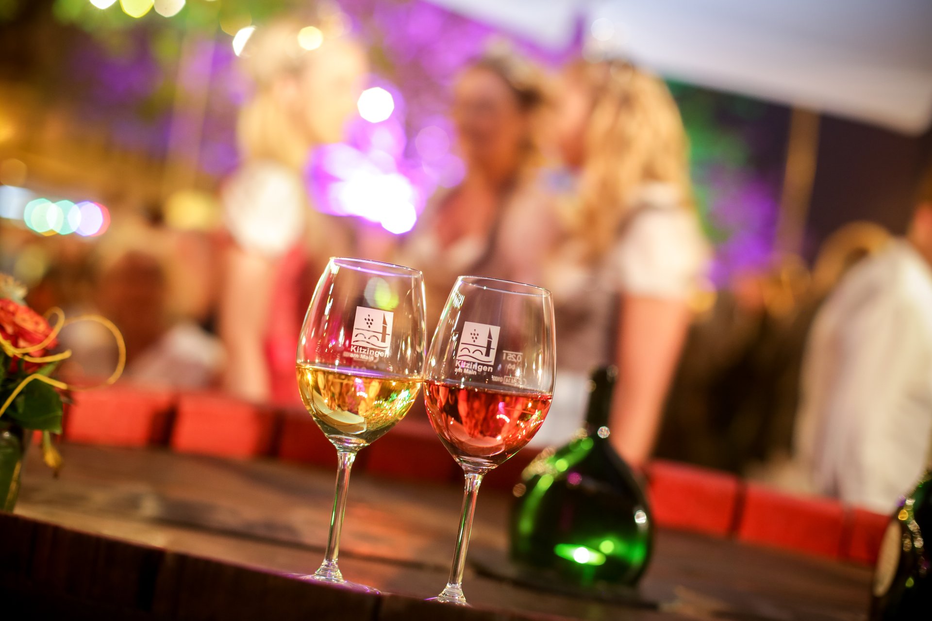 Two wine glasses and a Bocksbeutel at the Kitzingen Promenade Wine Festival